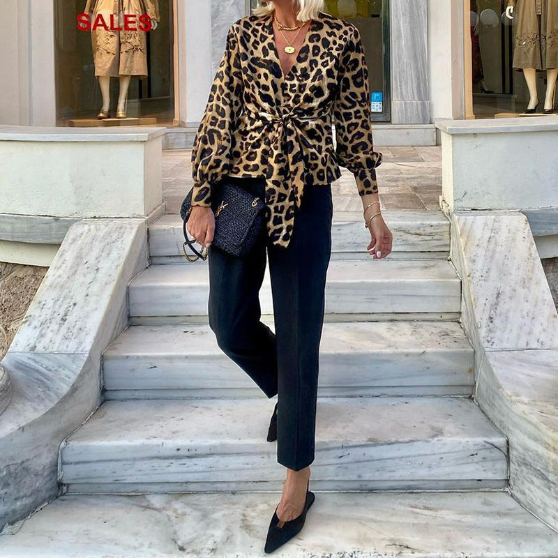 Women's blouse in modern animal print with deep V-neck and waist WW