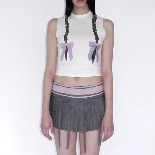 Women's sleeveless top with playful cable design and bow accents W&W